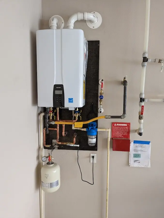 Professional plumber installing copper piping in a Fort Knox home